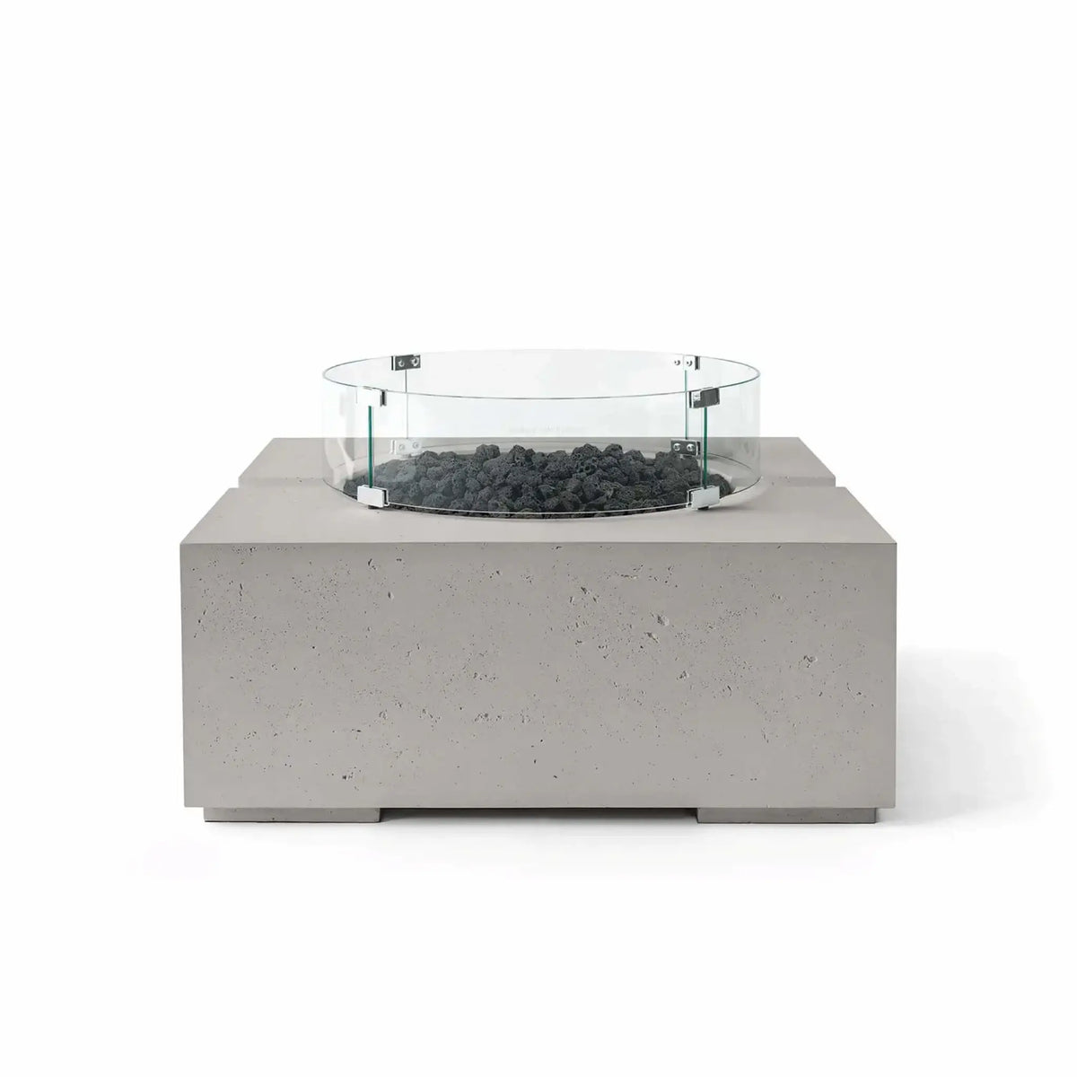 HPC Fire Hearth Products Controls Dekko GFRC Concrete Bravo 32 x 32 Fire Pit in Sandstone finish featuring black lava rock fire media and a tempered glass wind guard. The warm-toned GFRC concrete body contrasts with the dark volcanic rock, highlighting the fire pit’s clean geometric form, textured finish, and upscale outdoor entertainment appeal.
