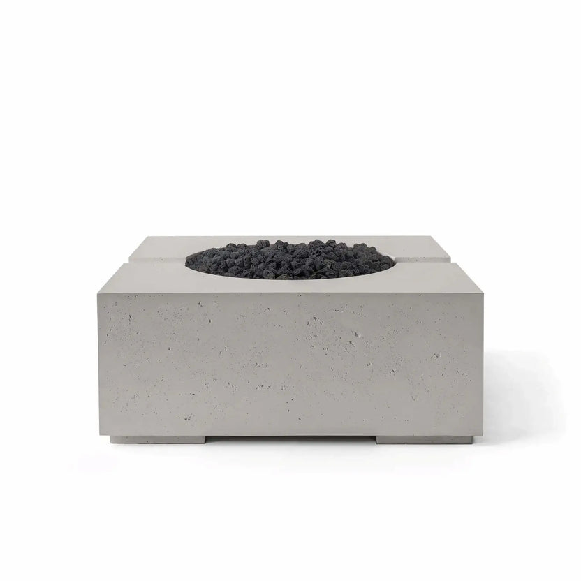 HPC Fire Hearth Products Controls Dekko GFRC Concrete Bravo 32 x 32 Fire Pit displayed in Sandstone finish with black Lava Rock media. The image highlights the fire pit’s contemporary square silhouette, textured GFRC concrete body, recessed burner opening, and dramatic contrast between the warm sandstone finish and dark volcanic rock fire media for upscale outdoor living areas.