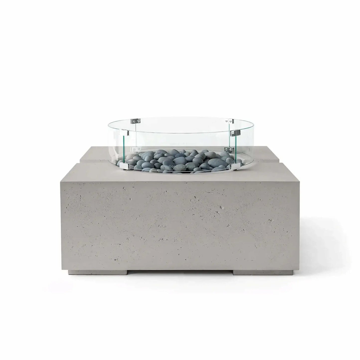 HPC Fire Hearth Products Controls Dekko GFRC Concrete Bravo 32 x 32 Fire Pit in Sandstone finish with Slate Stone fire media and a clear tempered glass wind guard. The combination of warm beige concrete and smooth gray stones delivers a refined contemporary look, while the square fire pit design and textured GFRC construction provide lasting outdoor style.