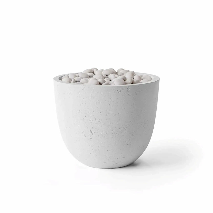 HPC Dekko GFRC Concrete Element 20 Round Fire Column in Ash finish, displayed with smooth ivory fire stones filling the burner opening. The modern bowl-shaped fire feature showcases a light gray concrete texture with subtle surface variations and a clean contemporary design. Product image isolated on a white background, highlighting the combination of Ash GFRC concrete and decorative ivory fire media.