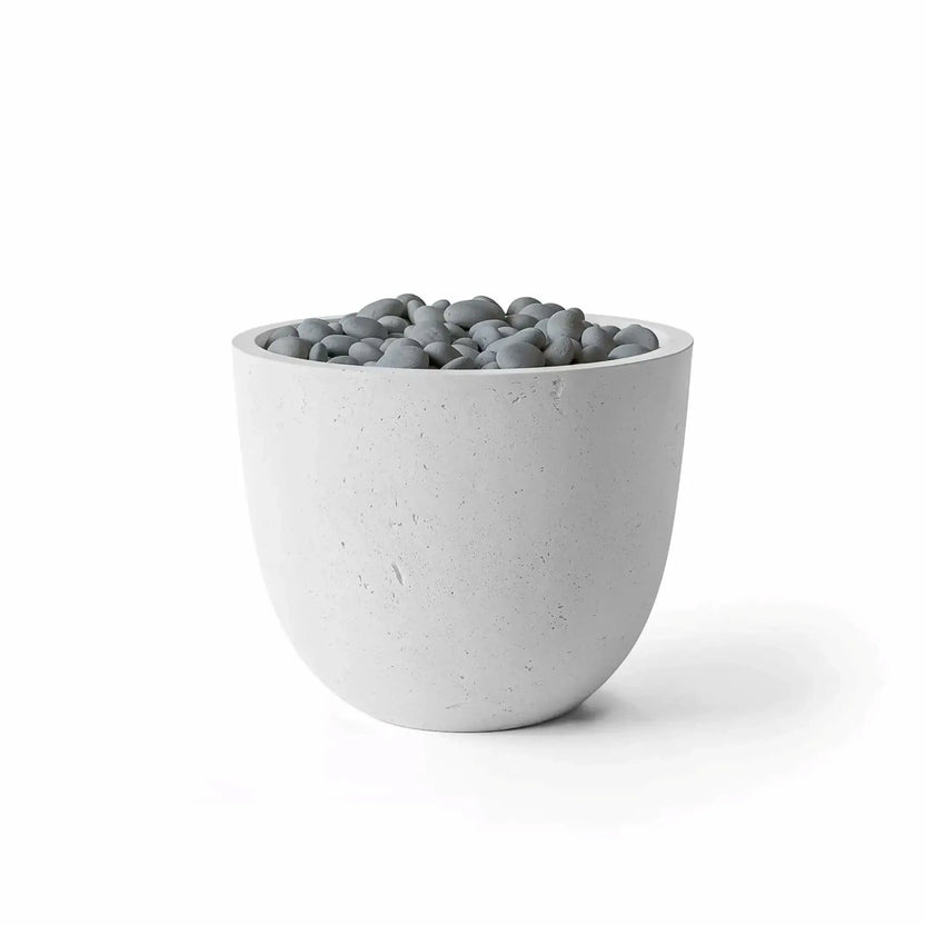 Dekko GFRC Concrete Element 20 Round Fire Column by HPC Fire Hearth Products Controls in an Ash finish with decorative Slate Stone fire media. The fire column features a smooth rounded concrete body, light gray coloration, and a burner opening filled with polished gray stones. Clean product photography on a white background showcasing the contemporary outdoor fire feature design.
