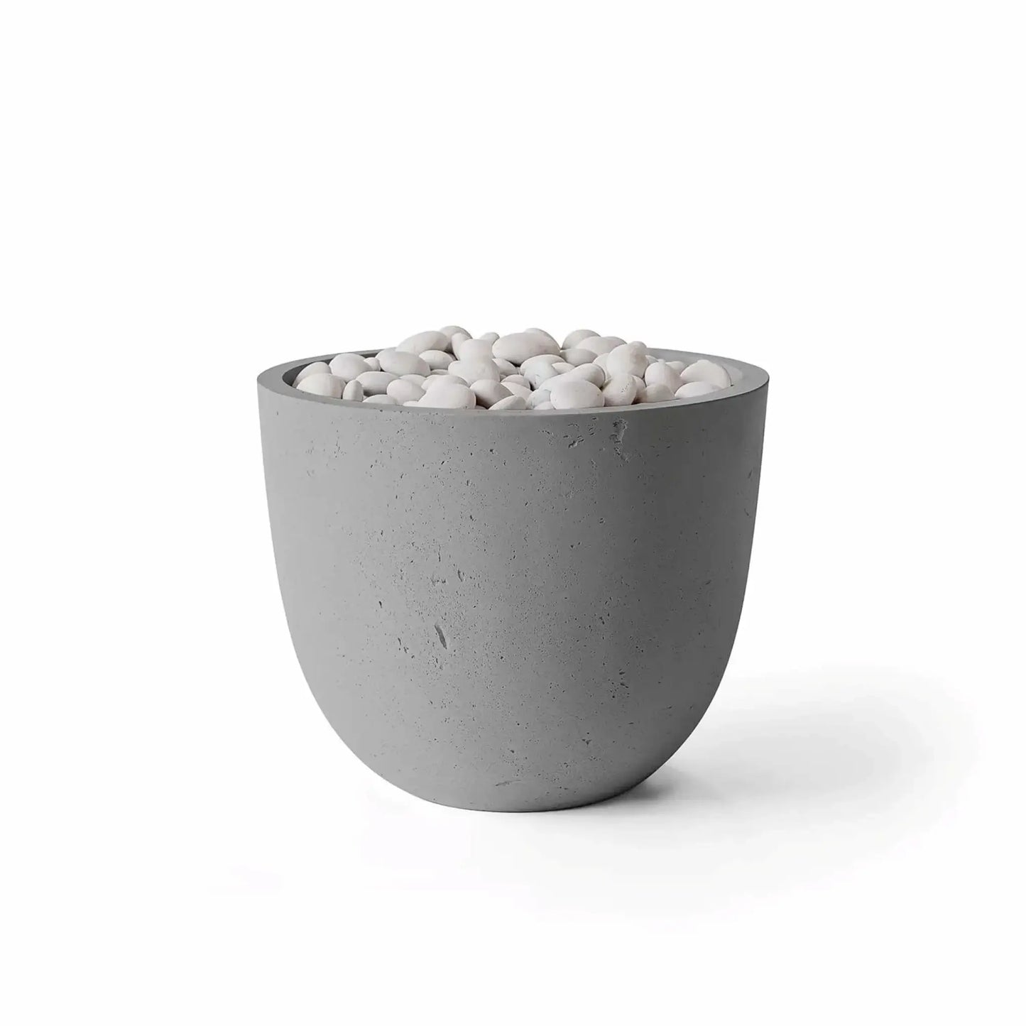 HPC Dekko GFRC Concrete Element 20 Round Fire Column in a Charcoal concrete finish accented with ivory fire stones. The dark gray rounded fire feature offers a modern architectural appearance with textured GFRC construction and smooth white decorative stones surrounding the burner area. Isolated product image on a white background highlighting the contrast between Charcoal concrete and Ivory Stone media.