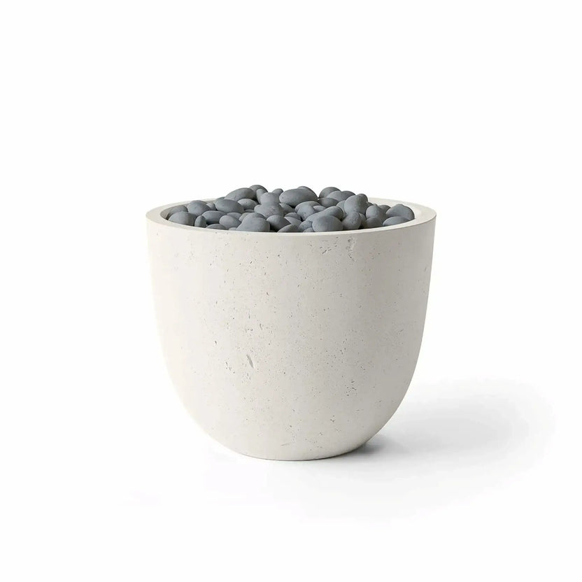 HPC Fire Hearth Products Controls Dekko GFRC Concrete Element 20 Round Fire Column featuring a Limestone finish with decorative Slate Stone media. The rounded concrete fire column showcases a light limestone-colored GFRC exterior and polished gray stones arranged across the burner opening. Product photography on a white background highlights the clean lines, textured surface, and modern outdoor design of the Limestone Slate Stone fire feature.
