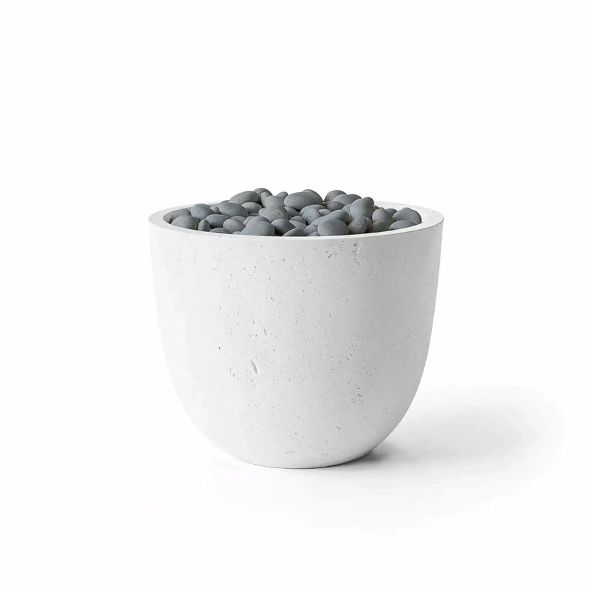 HPC Dekko GFRC Concrete Element 20 Round Fire Column featuring a Natural concrete finish and Slate Stone decorative media. The rounded outdoor fire feature showcases a light gray GFRC concrete body with subtle texture and polished gray stones covering the burner area. Product photography on a white background highlights the clean architectural shape and contemporary Natural Slate Stone configuration.
