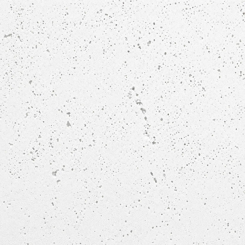 Close-up material swatch of HPC Fire Hearth Products Dekko GFRC Concrete Fire Pit Natural finish, displaying a light gray concrete texture with evenly distributed pinholes and subtle surface character. The neutral Natural finish complements a wide range of outdoor design styles and is commonly used on modern fire pit tables, fire bowls, and custom fire features.