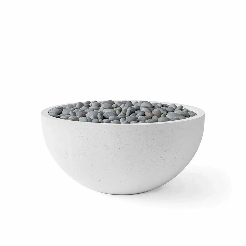 HPC Fire Hearth Products Controls Dekko GFRC Concrete Serenade 32 Fire Pit finished in Ash with decorative slate stone media. The modern round GFRC concrete fire bowl features a light gray ash-colored exterior and is filled with smooth gray slate stones covering the burner area. Clean product photography on a white background highlights the contemporary design for outdoor entertainment spaces and patio settings.