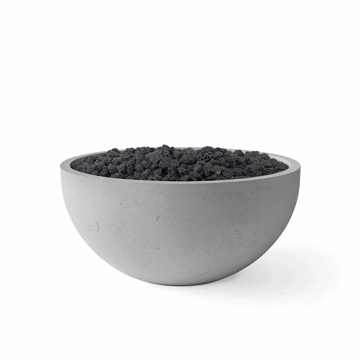 HPC Fire Hearth Products Controls Dekko GFRC Concrete Serenade 32 Fire Pit in Charcoal finish with black lava rock media. The round concrete fire bowl features a smooth charcoal gray GFRC construction, wide burner opening, and rugged volcanic lava rock filling the fire area. Isolated on a white background, this product image showcases a modern outdoor fire feature designed for patios, decks, and backyard gathering spaces.