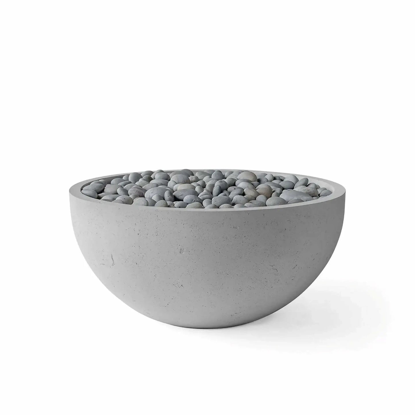 HPC Fire Hearth Products Controls Dekko GFRC Concrete Serenade 32 Fire Pit in Charcoal finish with decorative slate stone media. The modern round GFRC concrete fire pit bowl features a dark charcoal gray exterior paired with smooth gray slate stones covering the burner pan. Product image photographed on a white background, emphasizing the clean contemporary styling for outdoor living and fire feature applications.