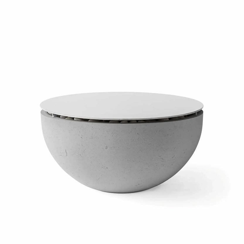 HPC Fire Hearth Products Controls Dekko GFRC Concrete Serenade 32 Fire Pit in Charcoal finish featuring a fitted Table Top Lid. The dark charcoal concrete fire bowl is paired with a circular metal cover that converts the fire feature into a practical outdoor table. Presented on a clean white background, the image highlights the contemporary bowl shape, textured GFRC construction, and versatile tabletop lid accessory.