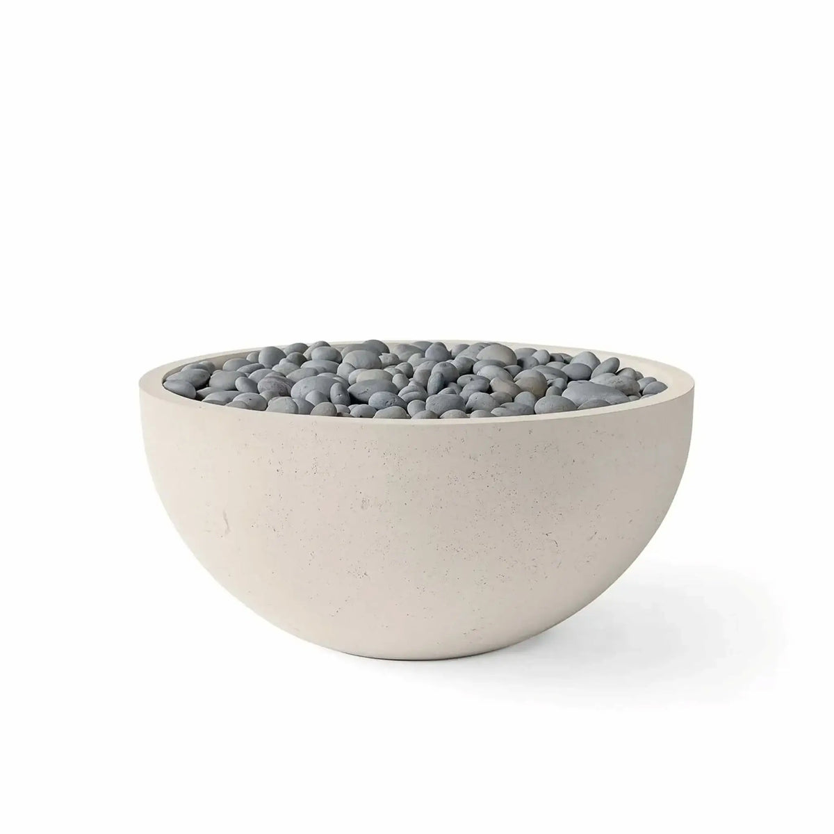 HPC Fire Hearth Products Controls Dekko GFRC Concrete Serenade 32 Fire Pit in Clay finish with slate stone fire media. The contemporary round fire bowl is constructed from durable GFRC concrete and features a warm beige exterior paired with smooth gray slate stones across the burner area. Studio product image on a white background showcases the elegant outdoor fire feature for patios, courtyards, and backyard living spaces.