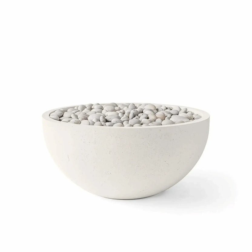 HPC Fire Hearth Products Controls Dekko GFRC Concrete Serenade 32 Fire Pit in Limestone finish with Ivory Stone media. The round GFRC concrete fire bowl features a warm limestone-colored exterior paired with smooth ivory decorative stones that provide a clean, natural appearance. Shown on a white background, this product image highlights the shape, finish texture, and media combination available for the Serenade 32 Fire Pit.