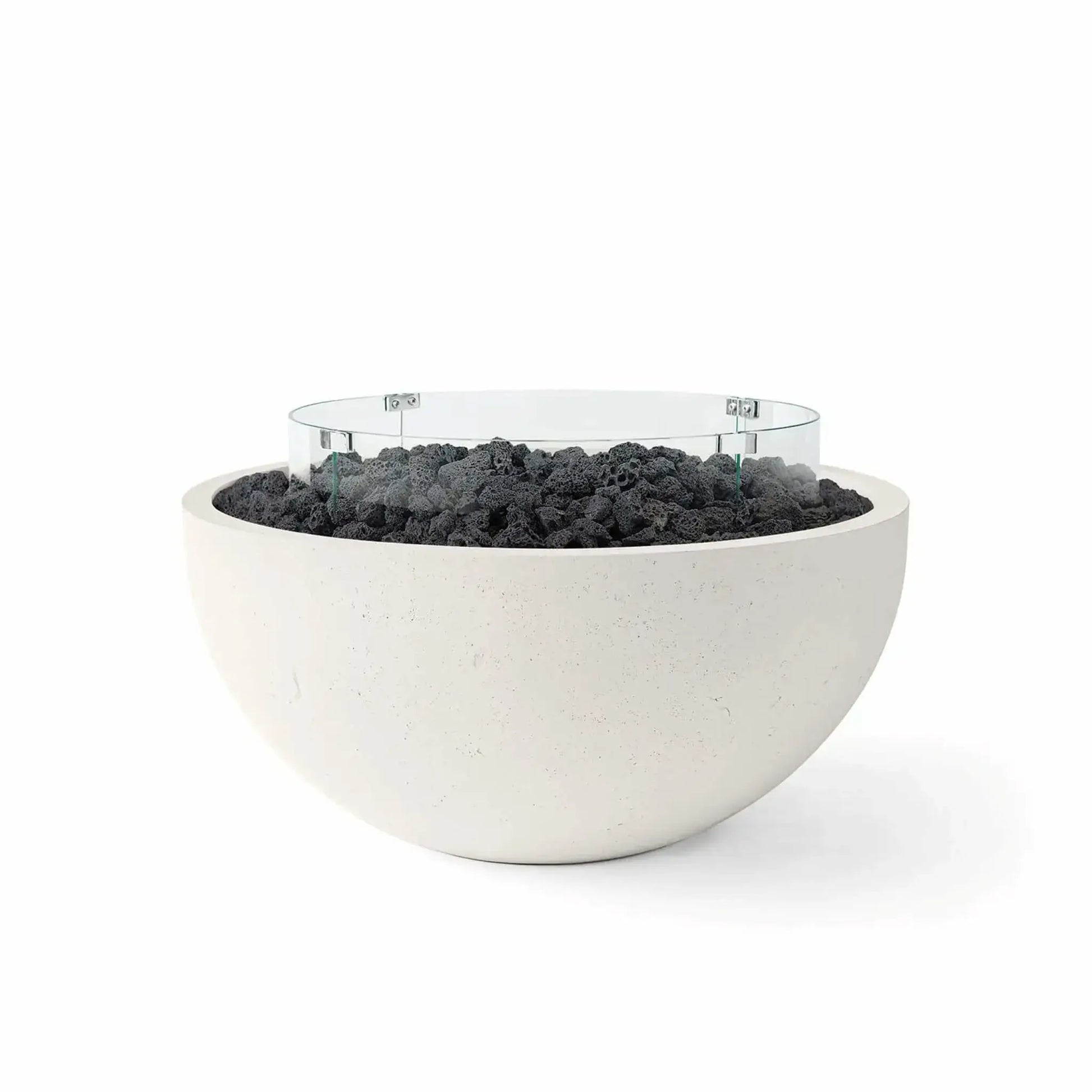 HPC Fire Hearth Products Controls Dekko GFRC Concrete Serenade 32 Fire Pit in Limestone finish featuring black lava rock media and a clear tempered glass wind guard. The contemporary round fire bowl showcases durable GFRC concrete construction, a smooth minimalist profile, and rugged volcanic rock fill, creating a striking outdoor fire feature ideal for patios, modern landscapes, poolside lounges, and backyard entertaining spaces.