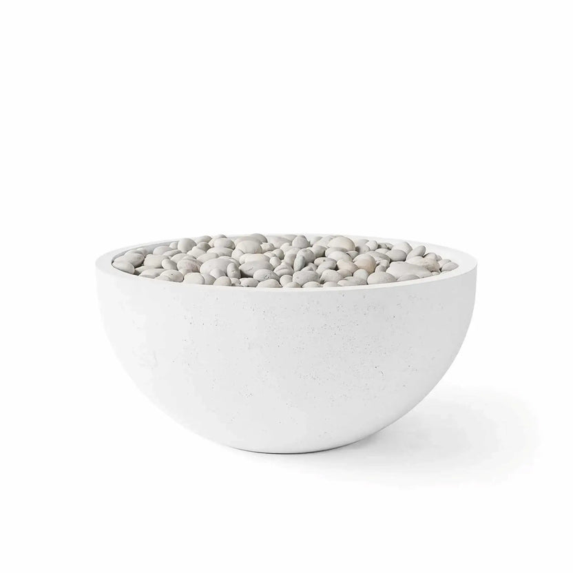 HPC Fire Hearth Products Controls Dekko GFRC Concrete Serenade 32 Fire Pit in Natural finish with Ivory Stone media. The round fire bowl showcases a soft natural concrete appearance complemented by smooth ivory decorative stones. Presented on a white background, this product image emphasizes the subtle texture of the GFRC concrete construction and the elegant contrast created by the ivory stone media.