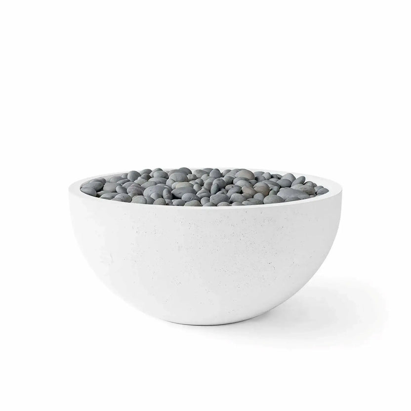 HPC Fire Hearth Products Controls Dekko GFRC Concrete Serenade 32 Fire Pit in Natural finish with Slate Stone media. The bowl-shaped GFRC concrete fire feature is filled with smooth gray slate stones that complement the natural concrete exterior. Displayed against a white background, this product image showcases a balanced, contemporary design suitable for modern patios, pool decks, and outdoor gathering spaces.