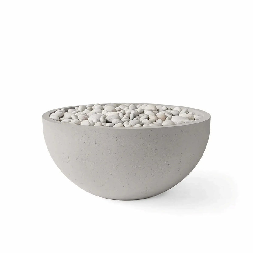 HPC Fire Hearth Products Controls Dekko GFRC Concrete Serenade 32 Fire Pit in Sandstone finish with Ivory Stone media. The round fire bowl features a warm sandstone-colored GFRC concrete exterior filled with smooth ivory decorative stones for a refined, upscale appearance. Shown on a white background, this product image highlights the finish color, bowl shape, and premium media combination available for the Serenade 32 Fire Pit.