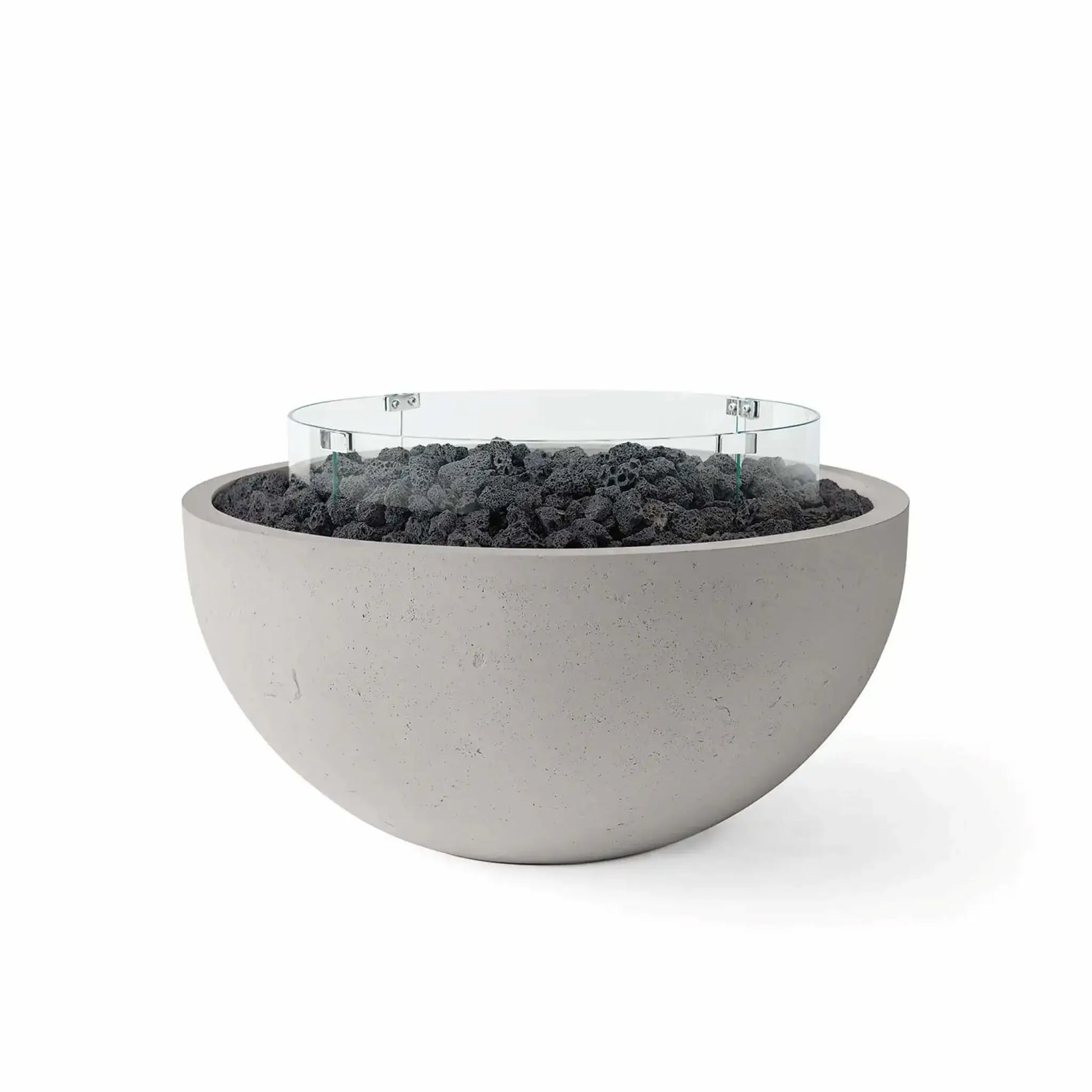 HPC Fire Hearth Products Controls Dekko GFRC Concrete Serenade 32 Fire Pit in Sandstone finish featuring black lava rock media and a circular tempered glass wind guard. The warm-toned GFRC concrete fire bowl contrasts beautifully with the volcanic rock fill, delivering a clean contemporary aesthetic perfect for outdoor patios, poolside gathering areas, and modern backyard living spaces.