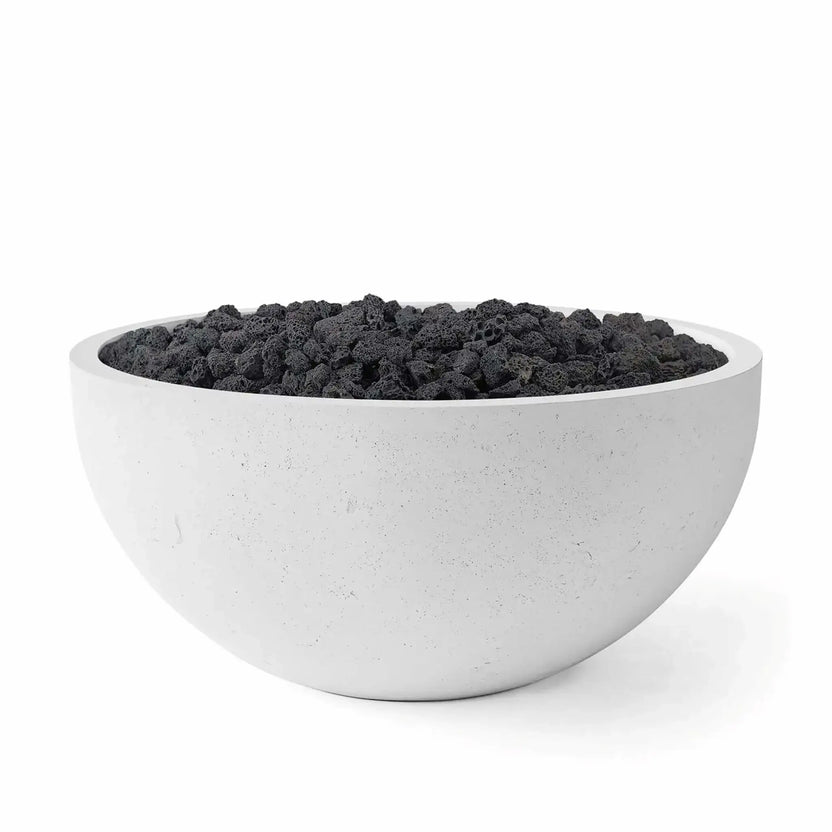 HPC Fire Hearth Products Controls Dekko GFRC Concrete Serenade 40 Fire Pit in Ash finish filled with black lava rock fire media. The round GFRC concrete fire bowl features a smooth light gray exterior, subtle concrete texture, and wide circular rim. Studio product image emphasizes the contrast between the Ash concrete finish and rugged volcanic lava rock, ideal for modern outdoor fire pit installations and backyard gathering spaces.