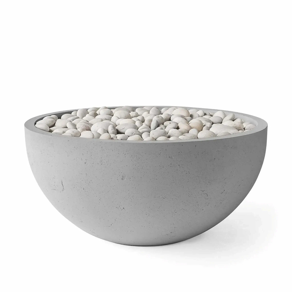HPC Fire Hearth Products Controls Dekko GFRC Concrete Serenade 40 Fire Pit in Charcoal finish featuring ivory decorative stones. The round concrete fire bowl combines a darker gray GFRC concrete exterior with smooth white river stones for a striking contemporary appearance. Product image highlights the wide rim, textured finish, and minimalist outdoor fire pit design suited for modern patios, poolside settings, and outdoor entertainment areas.