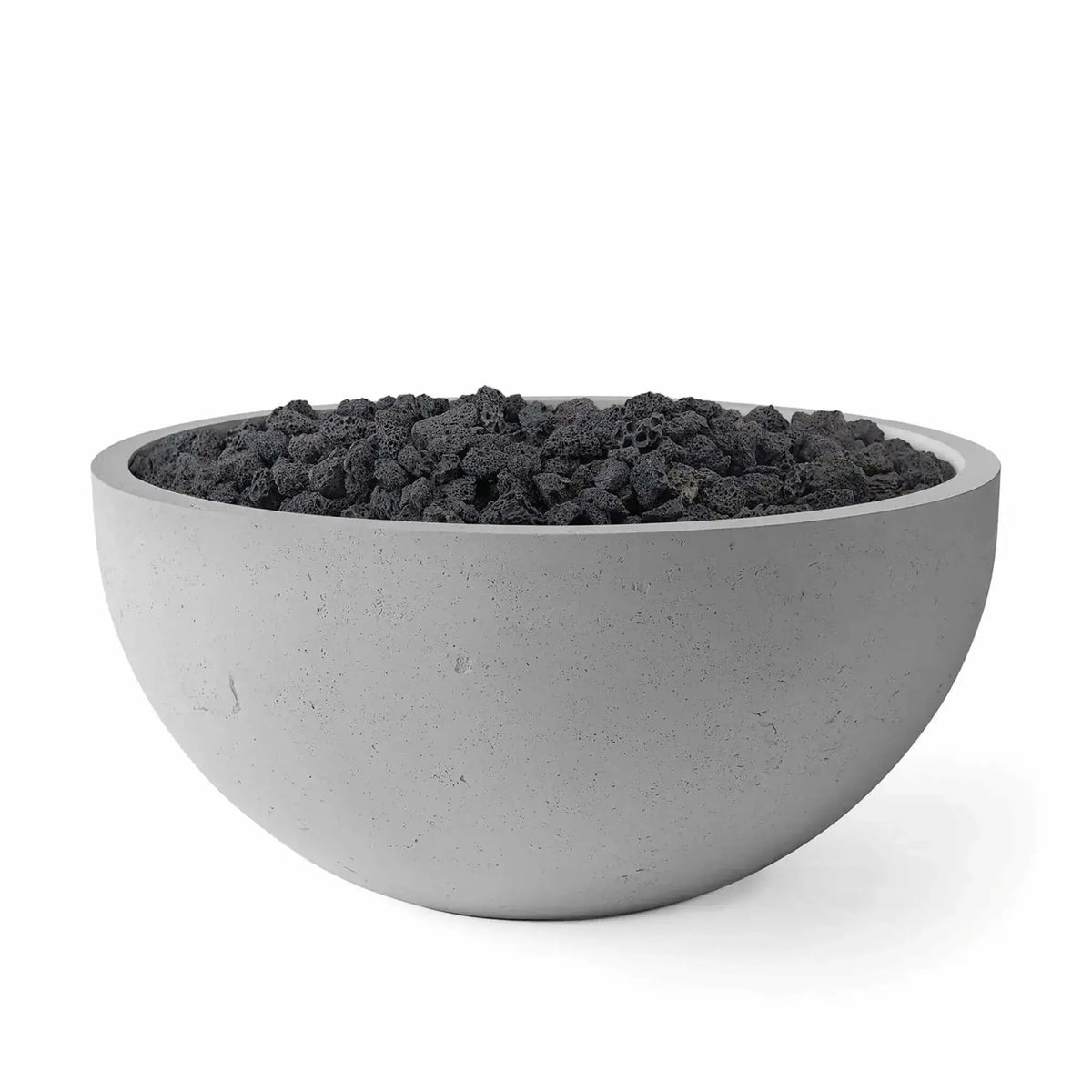 HPC Fire Hearth Products Controls Dekko GFRC Concrete Serenade 40 Fire Pit in Charcoal finish with black lava rock media. This round GFRC concrete fire bowl features a rich gray textured surface, broad circular opening, and rugged volcanic rock fill. Studio product image showcases the modern outdoor fire pit design, emphasizing durability, clean lines, and the dramatic contrast between the charcoal concrete finish and dark fire media.