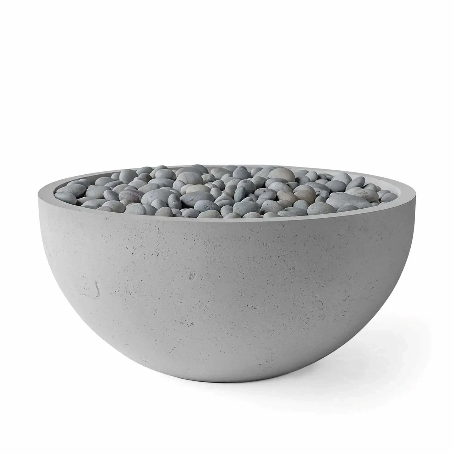 HPC Fire Hearth Products Controls Dekko GFRC Concrete Serenade 40 Fire Pit in Charcoal finish with slate stone fire media. The round GFRC concrete bowl displays a textured gray exterior and a bed of smooth gray decorative stones across the burner area. Product photo on a white background highlights the modern low-profile silhouette and premium outdoor fire feature styling designed for upscale patios and backyard living environments.