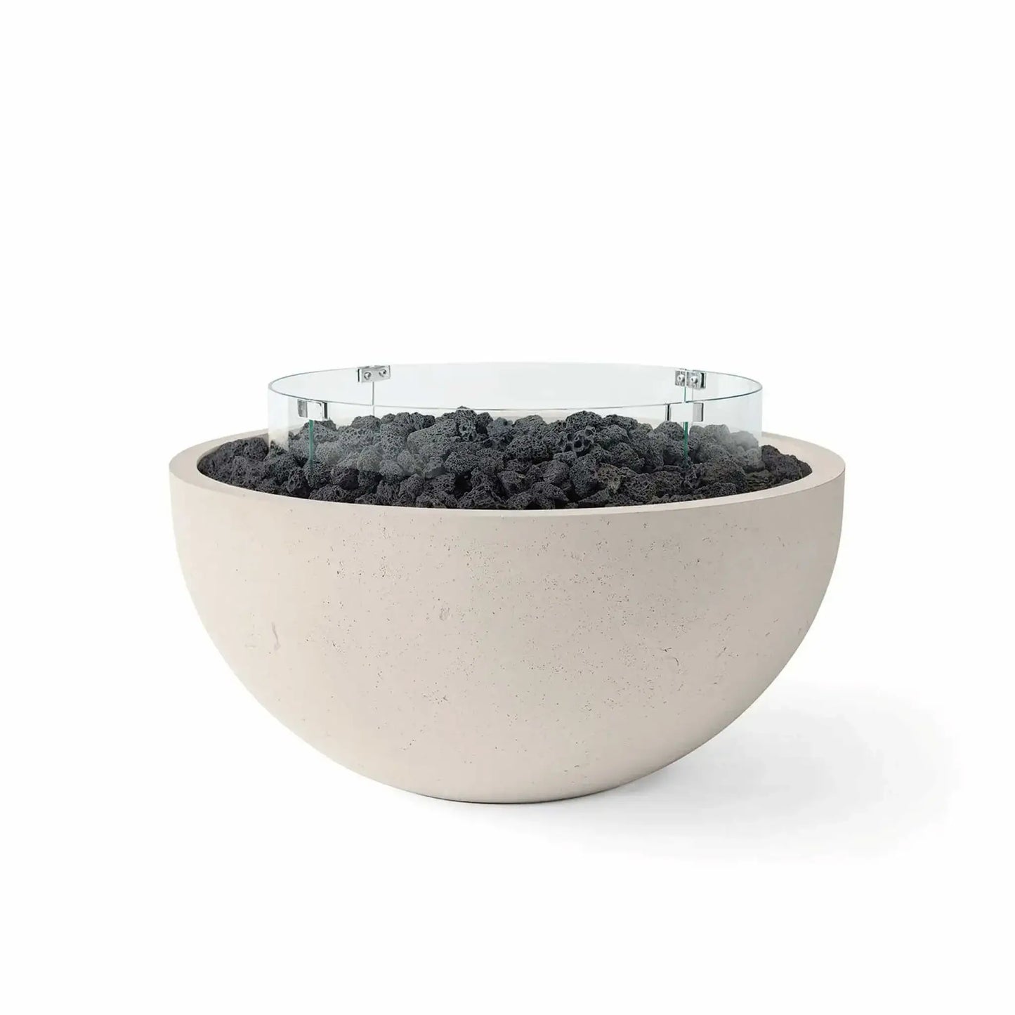 HPC Fire Hearth Products Controls Dekko GFRC Concrete Serenade 40 Fire Pit in Clay finish with black lava rock fire media and a tempered glass wind guard. This modern GFRC concrete fire bowl combines a soft beige clay tone with textured volcanic lava rock and a circular glass windscreen, delivering a bold contrast and stylish focal point for outdoor living and entertainment spaces.
