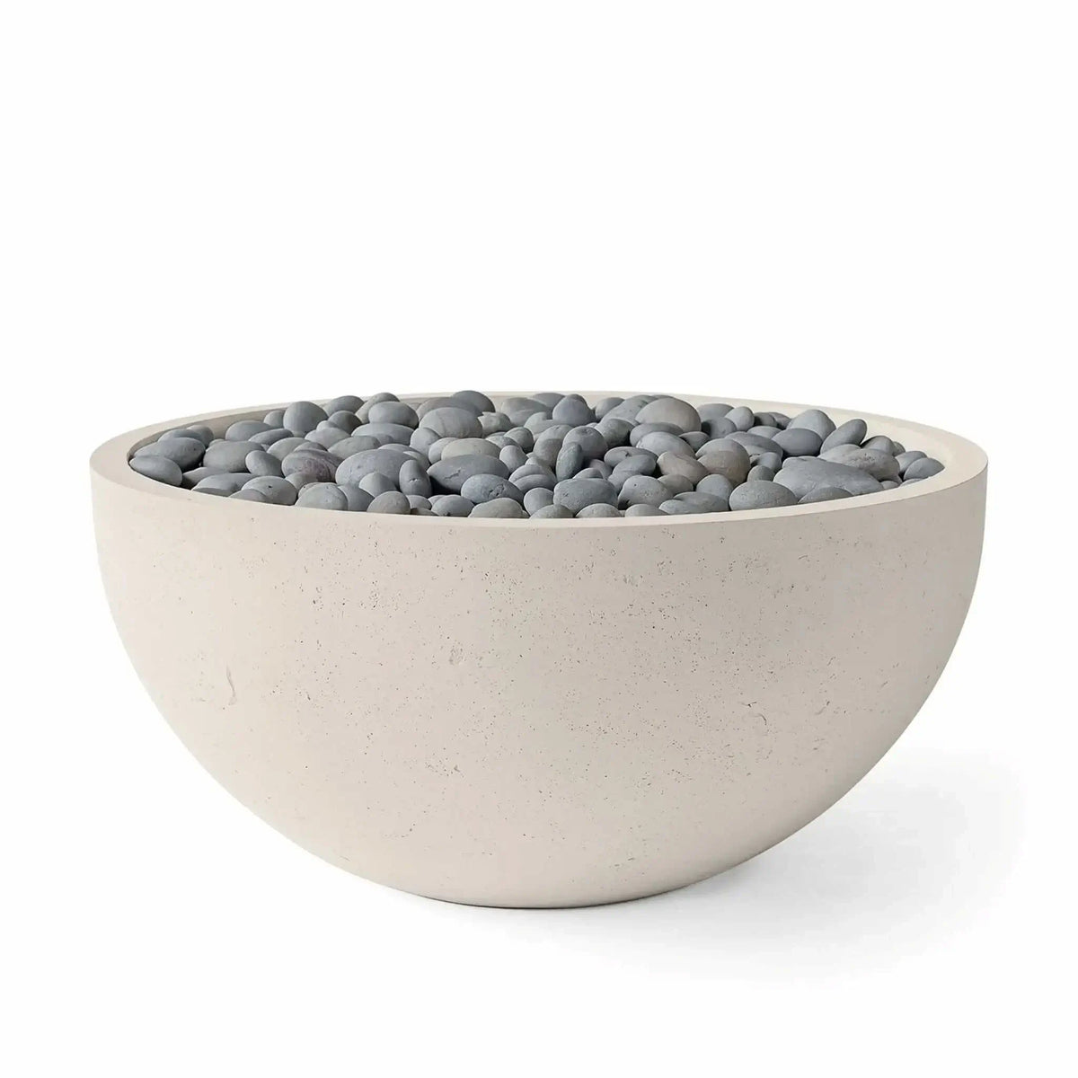 HPC Fire Hearth Products Controls Dekko GFRC Concrete Serenade 40 Fire Pit in Clay finish with slate stone media. The round fire bowl showcases a warm beige GFRC concrete exterior, smooth curved profile, and decorative gray slate stones covering the burner opening. Product image emphasizes the contemporary outdoor fire pit aesthetic, durable construction, and versatile design suitable for residential patios and landscape projects.