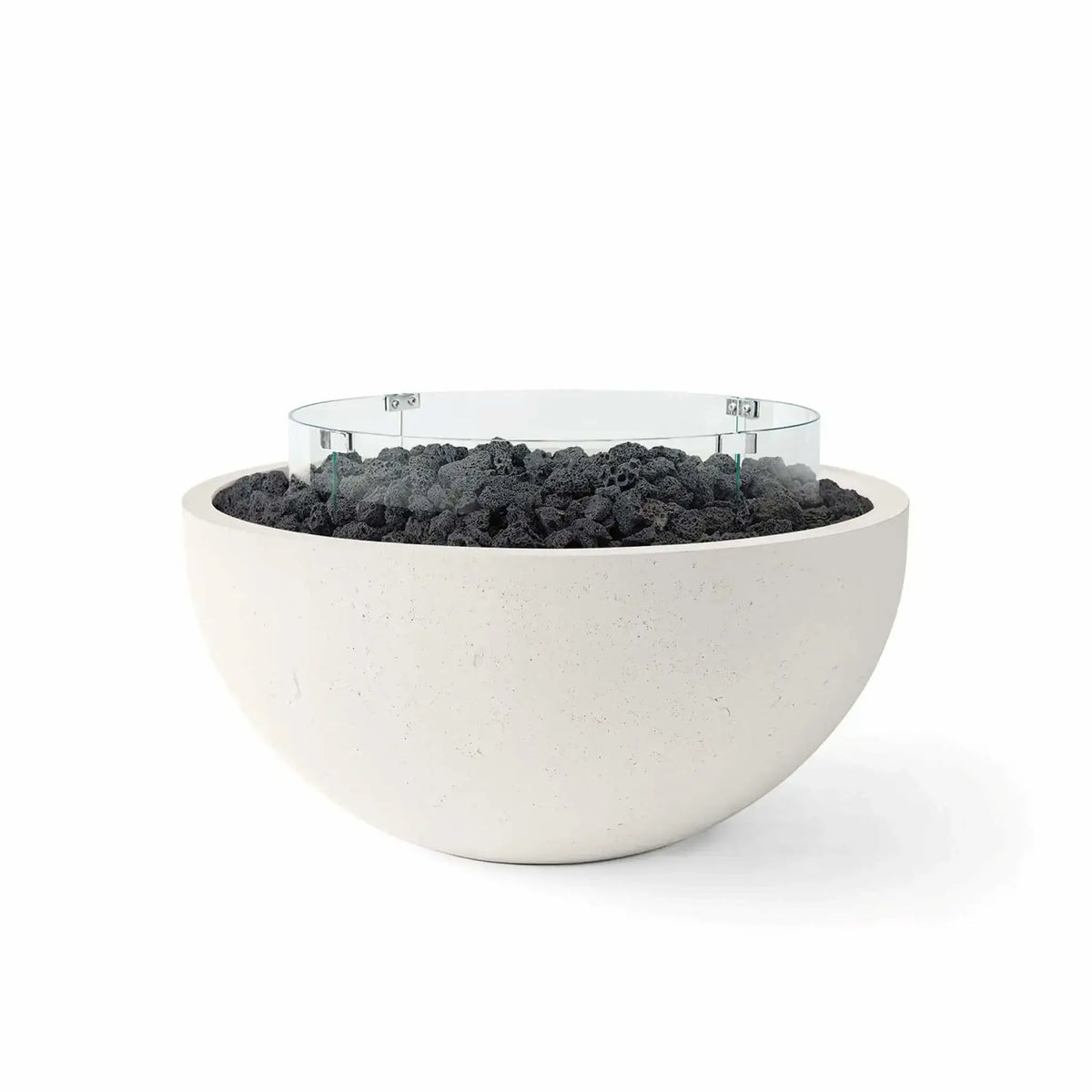 HPC Fire Hearth Products Controls Dekko GFRC Concrete Serenade 40 Fire Pit in Limestone finish featuring black lava rock fire media and a clear tempered glass wind guard. This contemporary round GFRC concrete fire bowl combines a soft limestone-colored exterior with rugged volcanic lava rock and a circular glass flame barrier, creating a clean, modern outdoor fire feature ideal for luxury patios, poolside spaces, and upscale backyard entertaining areas.