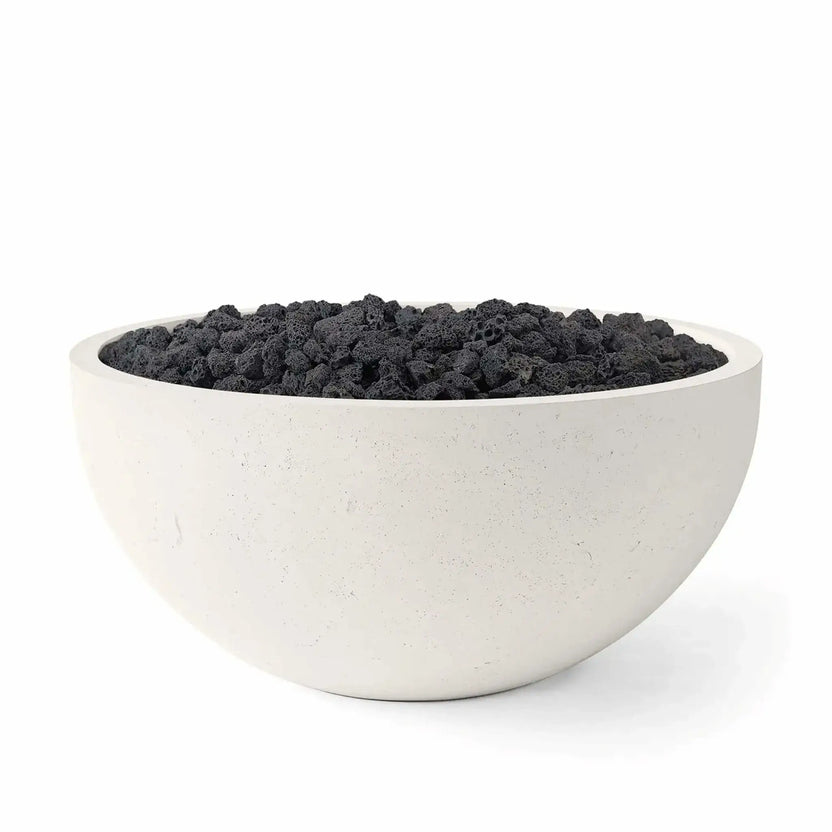 HPC Fire Hearth Products Controls Dekko GFRC Concrete Serenade 40 Fire Pit in Limestone finish featuring black Lava Rock fire media. The product image showcases the bowl-shaped concrete fire pit with a textured limestone-colored exterior and rugged volcanic rock fill, offering a contemporary outdoor fire feature designed for patios, entertainment spaces, and modern landscape installations.