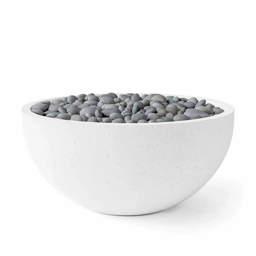 HPC Fire Hearth Products Controls Dekko GFRC Concrete Serenade 40 Fire Pit in Natural finish with Slate Stone media. The product image displays a modern round concrete fire bowl filled with smooth gray decorative stones, emphasizing the natural concrete texture, minimalist profile, and versatile aesthetic suited for upscale outdoor living and landscape projects.