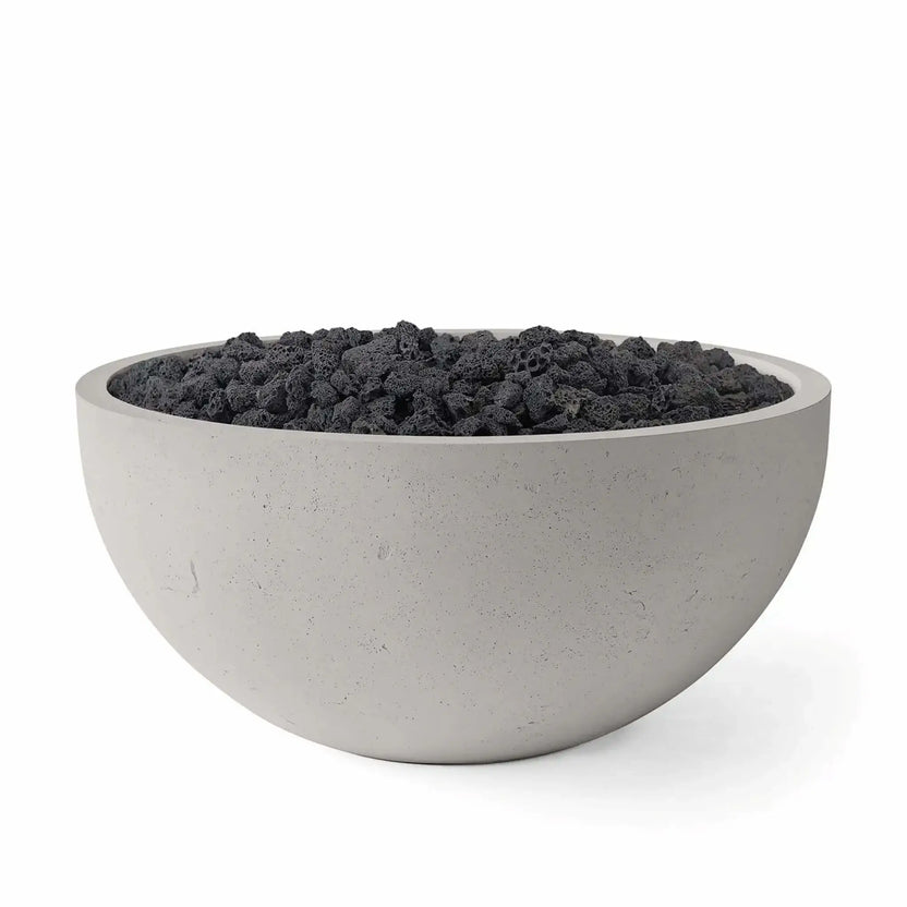 HPC Fire Hearth Products Controls Dekko GFRC Concrete Serenade 40 Fire Pit in Sandstone finish featuring Lava Rock media. The image showcases a modern GFRC concrete fire bowl with a warm sandstone tone and dark volcanic rock fill, creating a striking visual contrast while highlighting the fire pit’s durable construction and contemporary outdoor design appeal.