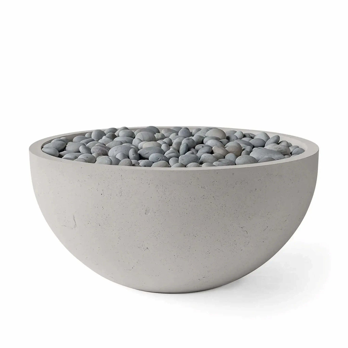 HPC Fire Hearth Products Controls Dekko GFRC Concrete Serenade 40 Fire Pit in Sandstone finish with Slate Stone media. This product image features a round concrete fire bowl filled with smooth gray slate stones, emphasizing the subtle sandstone texture, balanced neutral color palette, and elegant design intended for luxury patios, poolside environments, and modern outdoor living areas.