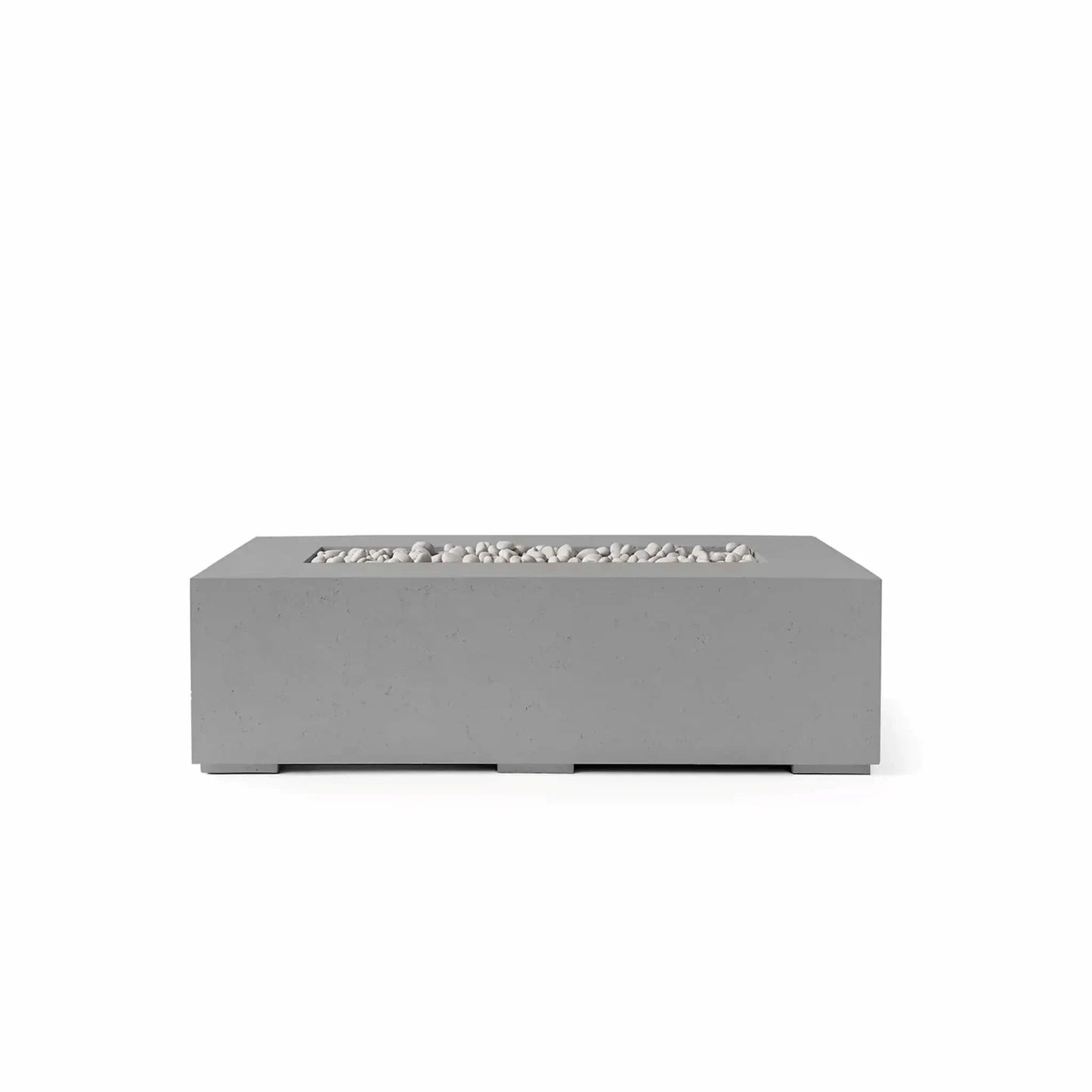 HPC Fire Hearth Products Controls Dekko GFRC Concrete Sonoma 56 x 30 Fire Pit in Charcoal finish with Ivory Stone fire media. This modern rectangular outdoor fire pit combines a dark gray GFRC concrete exterior with light decorative stones inside the recessed linear burner opening. The clean architectural design, durable construction, and spacious tabletop surface make it ideal for contemporary outdoor seating and entertainment areas.