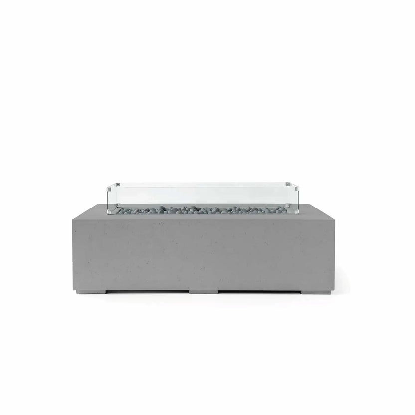 HPC Fire Hearth Products Controls Dekko GFRC Concrete Sonoma 56 x 30 Fire Pit in Charcoal finish with Slate Stone media and a tempered glass wind guard. The rectangular outdoor fire pit showcases a durable GFRC concrete construction, decorative gray slate stones within the linear burner channel, and a clear wind guard mounted above the fire area. Its modern silhouette and neutral charcoal tone make it a versatile addition to contemporary outdoor seating and entertainment spaces.