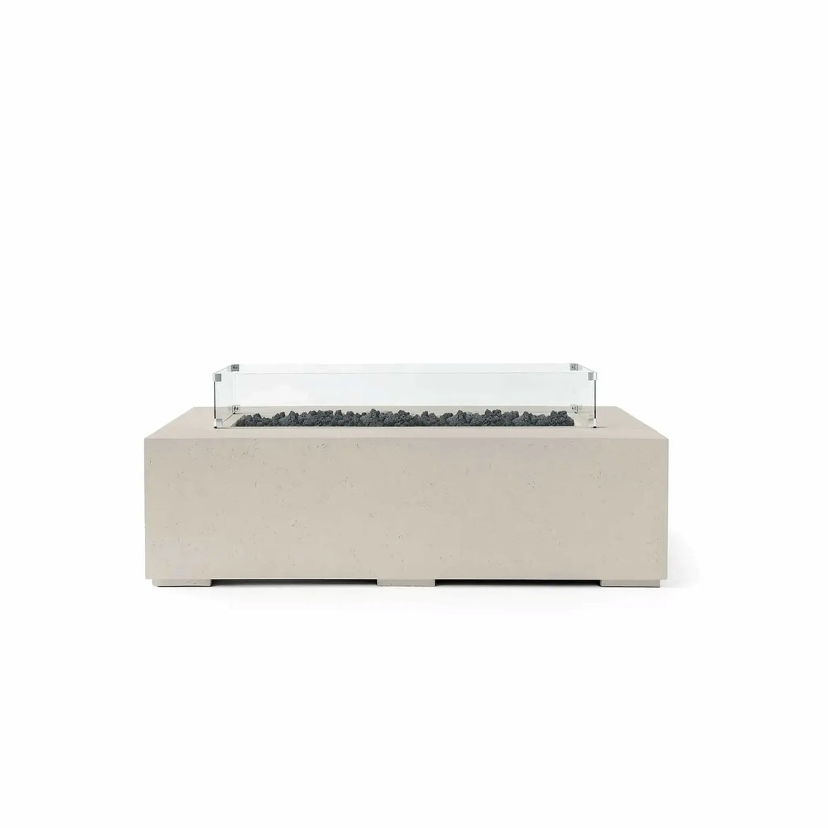 HPC Fire Hearth Products Controls Dekko GFRC Concrete Sonoma 56 x 30 Fire Pit finished in Clay with black Lava Rock media and a tempered glass wind guard. The warm-toned GFRC concrete body is paired with a recessed burner channel filled with dark volcanic lava rock, creating a bold visual contrast. The transparent wind guard enhances functionality and style, making this Sonoma fire pit a sophisticated outdoor centerpiece.