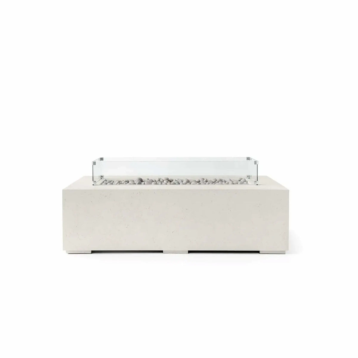 HPC Fire Hearth Products Controls Dekko GFRC Concrete Sonoma 56 x 30 Fire Pit in Limestone finish featuring Ivory Stone media and a tempered glass wind guard. The light limestone-colored concrete body complements the smooth ivory stones arranged across the recessed linear burner channel, while the transparent wind guard helps shield flames from wind. This contemporary outdoor fire pit offers a clean architectural appearance that fits seamlessly into modern patios, poolside retreats, and upscale outdoor ente