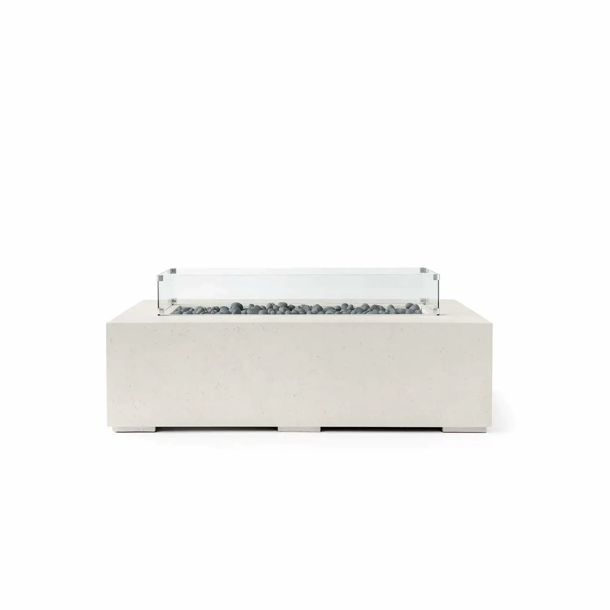HPC Fire Hearth Products Controls Dekko GFRC Concrete Sonoma 56 x 30 Fire Pit in Limestone finish with Slate Stone fire media and a tempered glass wind guard. This contemporary rectangular fire pit features durable GFRC concrete construction, a recessed linear burner filled with smooth gray slate stones, and a clear glass wind guard for enhanced flame protection. The soft limestone tone and minimalist design complement modern outdoor living environments.