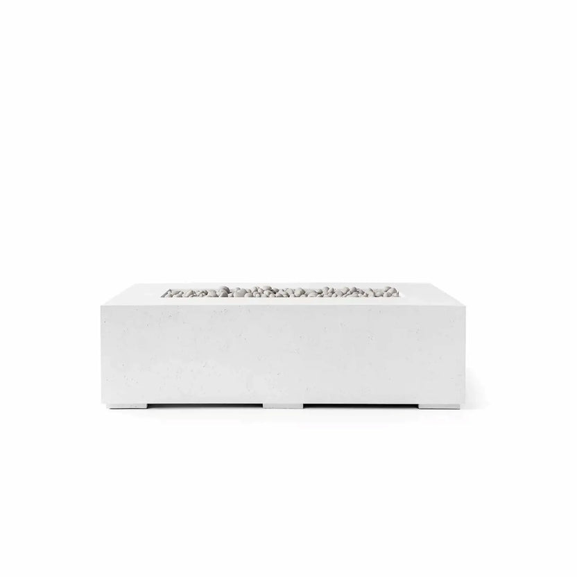 HPC Fire Hearth Products Controls Dekko GFRC Concrete Sonoma 56 x 30 Fire Pit in Natural finish with Ivory Stone media. The rectangular outdoor fire pit features a light concrete-look GFRC body, broad tabletop surface, and recessed linear burner area filled with smooth ivory stones. Displayed in a front-facing product image on a white background, the Sonoma fire pit offers timeless contemporary styling for outdoor entertainment and relaxation spaces.