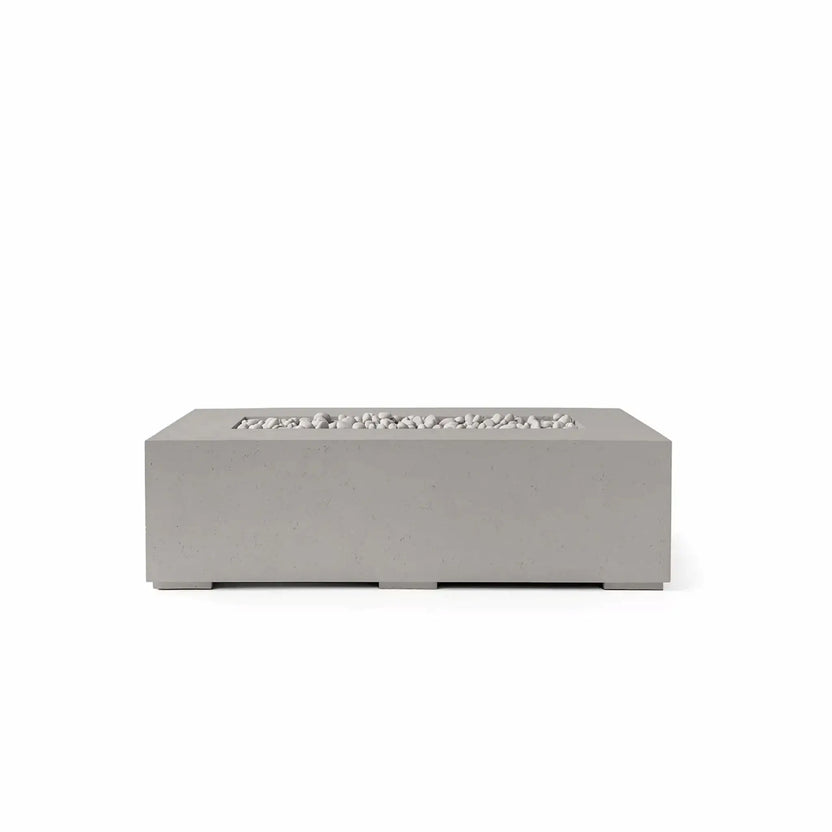 HPC Fire Hearth Products Controls Dekko GFRC Concrete Sonoma 56 x 30 Fire Pit in Sandstone finish featuring Ivory Stone media. This rectangular outdoor gas fire pit combines a warm sandstone-colored GFRC concrete body with smooth ivory fire stones arranged within the recessed linear burner area. The clean, modern profile and durable construction make the Sonoma fire pit an elegant focal point for patios, poolside seating areas, and upscale outdoor entertaining spaces.