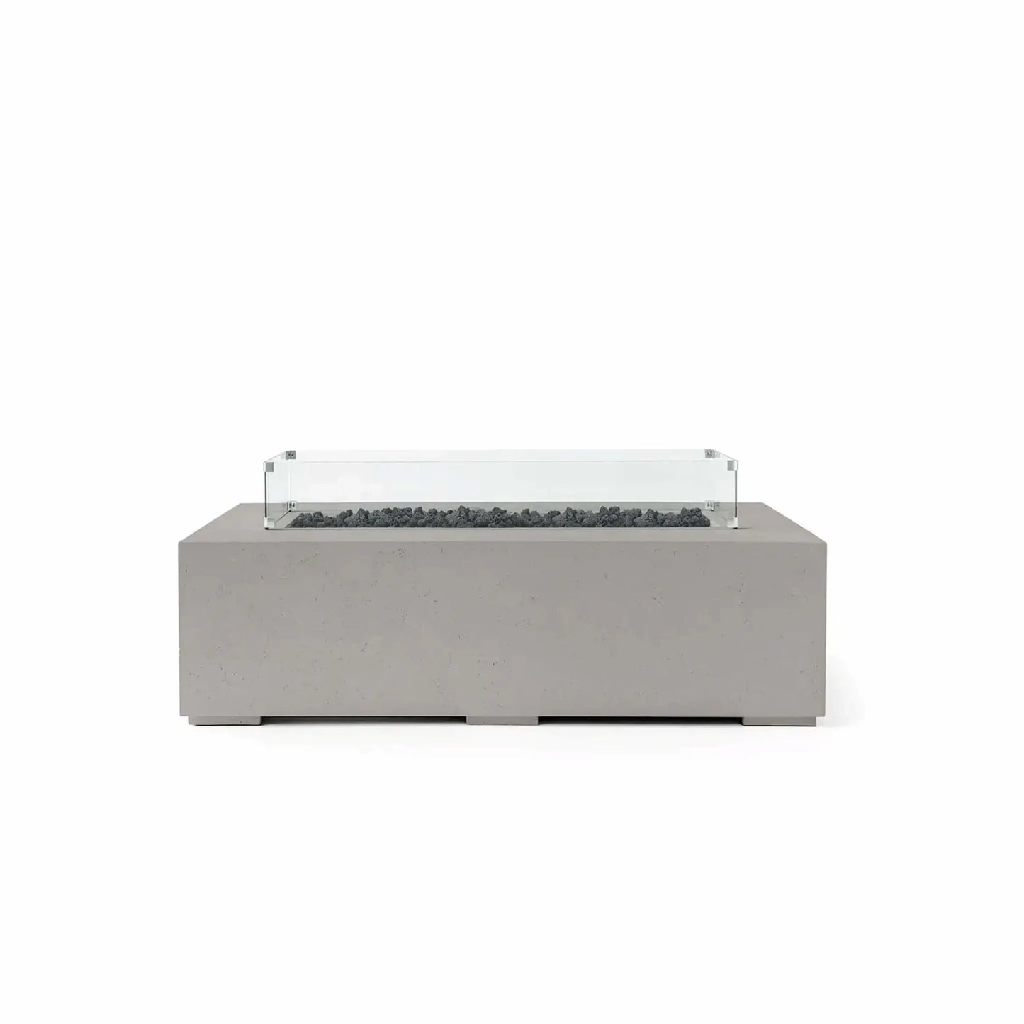 HPC Fire Hearth Products Controls Dekko GFRC Concrete Sonoma 56 x 30 Fire Pit in Sandstone finish featuring black Lava Rock media and a tempered glass wind guard. This rectangular outdoor fire pit combines a warm sandstone GFRC concrete body with dark volcanic lava rock inside the recessed burner channel, creating strong visual contrast. The transparent glass wind guard completes the sophisticated design while helping protect flames from outdoor breezes.