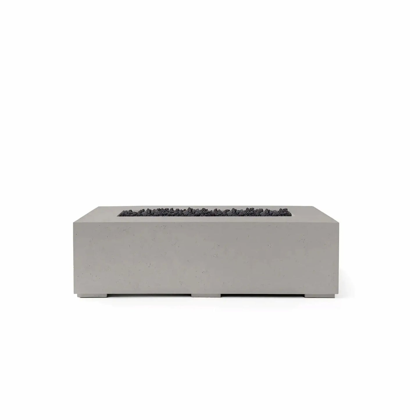 HPC Fire Hearth Products Controls Dekko GFRC Concrete Sonoma 56 x 30 Fire Pit finished in Sandstone with black Lava Rock burner media. The rectangular Sonoma fire pit features a textured GFRC concrete exterior, broad tabletop edge, and a recessed burner channel filled with dark volcanic rock for striking visual contrast. Shown in a clean product image, this contemporary outdoor fire feature is designed for modern patios, courtyards, and backyard gathering areas.