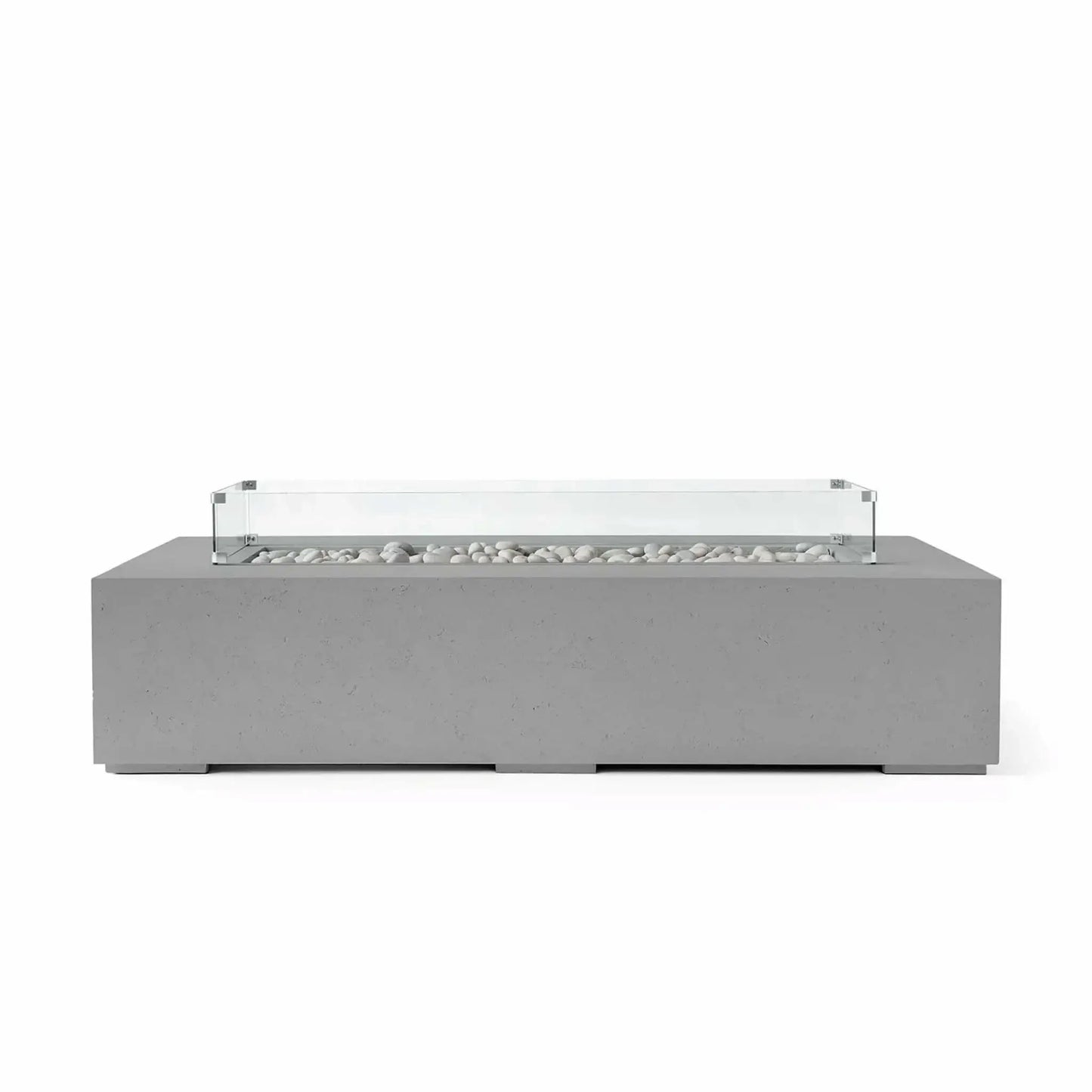 HPC Fire Hearth Products Controls Dekko GFRC Concrete Sonoma 72 x 33 Fire Pit in Charcoal finish with ivory fire stones and a clear tempered glass wind guard. The dark concrete body contrasts beautifully with the light stone media, highlighting the fire feature’s clean rectangular shape and contemporary outdoor design for upscale patios and backyard gathering spaces.