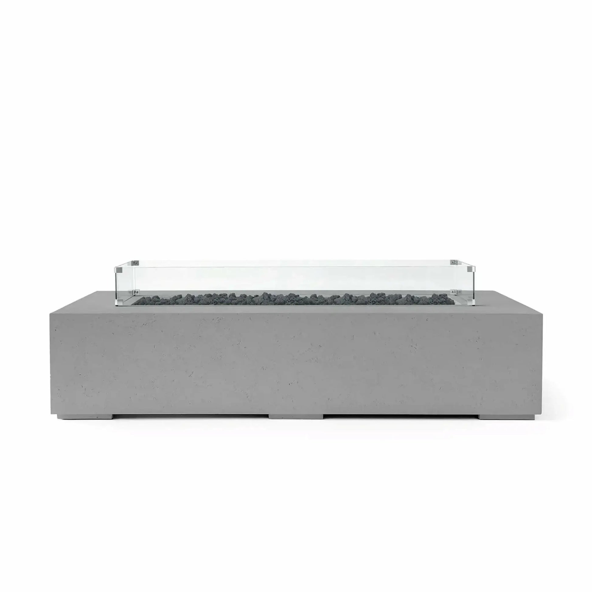 HPC Fire Hearth Products Controls Dekko GFRC Concrete Sonoma 72 x 33 Fire Pit in Charcoal finish featuring black lava rock media and a tempered glass wind guard. This modern rectangular fire pit table offers a bold contemporary appearance with durable GFRC concrete construction, making it a stylish and functional addition to luxury outdoor living environments.