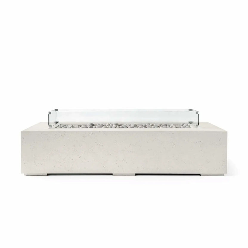 HPC Fire Hearth Products Controls Dekko GFRC Concrete Sonoma 72 x 33 Fire Pit in Limestone finish with ivory fire stones and a tempered glass wind guard. The light-colored concrete body, clean rectangular profile, and decorative stone media create a bright contemporary outdoor fire feature designed to serve as an elegant centerpiece for patios, decks, and upscale outdoor living spaces.