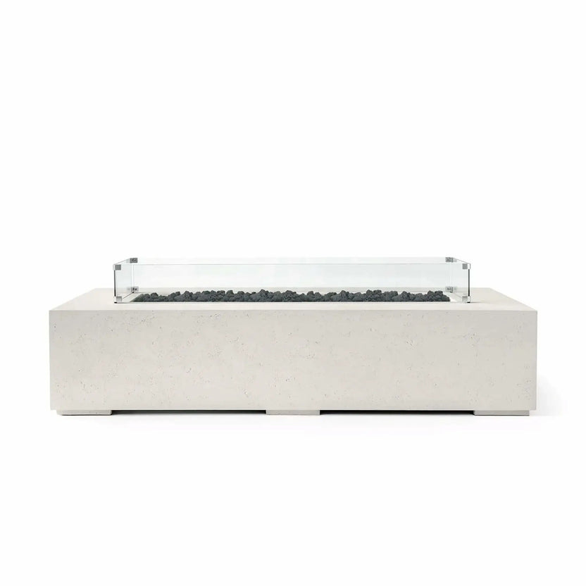 HPC Fire Hearth Products Controls Dekko GFRC Concrete Sonoma 72 x 33 Fire Pit in Limestone finish featuring black lava rock fire media and a clear tempered glass wind guard. This rectangular outdoor fire pit table showcases durable GFRC concrete construction, clean architectural lines, and a contemporary low-profile design ideal for patios, rooftop terraces, luxury outdoor lounges, and modern backyard living spaces.
