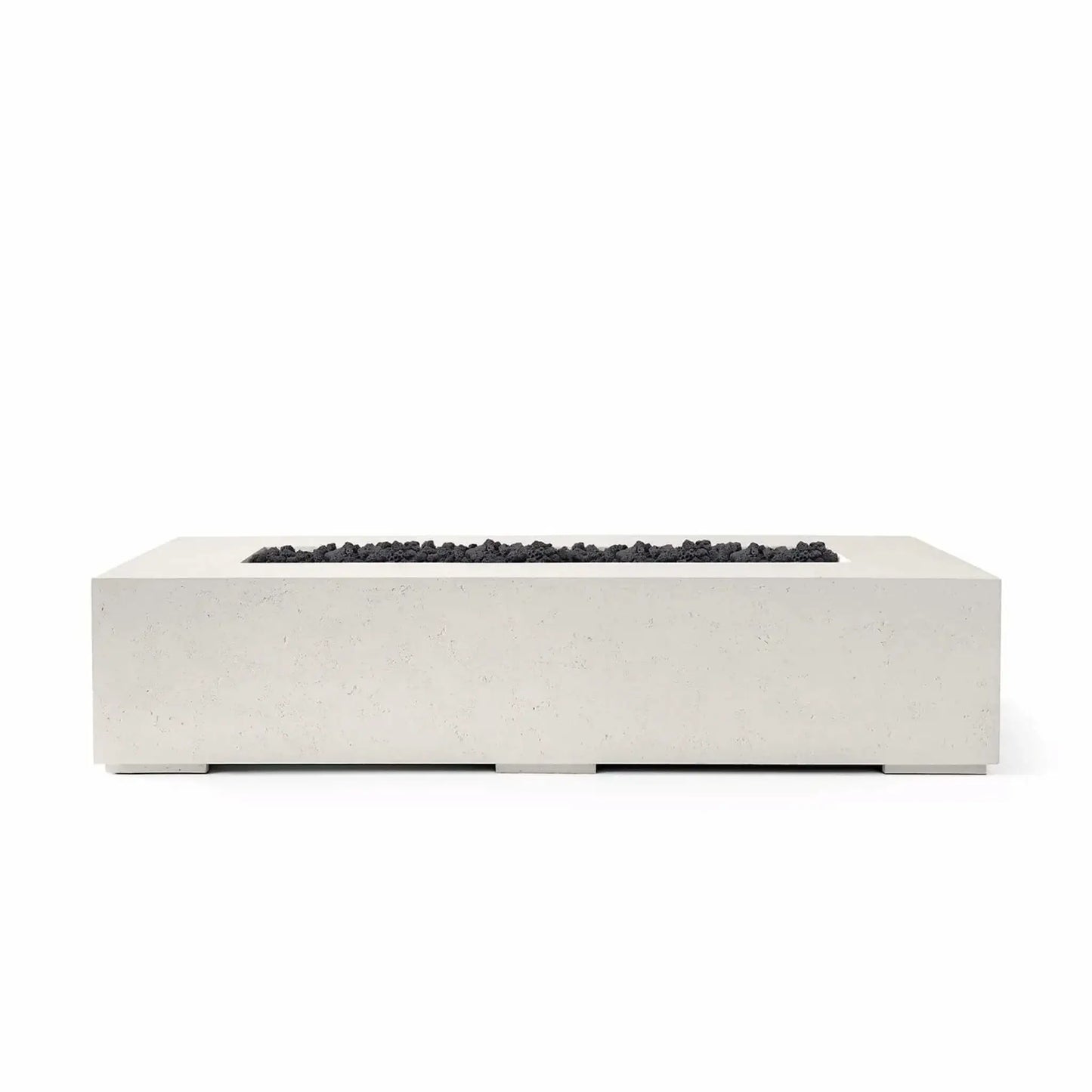 Studio product image of the Dekko Sonoma 72 x 33 GFRC Concrete Fire Pit finished in Limestone and filled with Lava Rock fire media. The rectangular fire pit showcases a minimalist architectural design with a recessed burner channel accented by rugged black lava rock. Presented on a white background, the image emphasizes the contrast between the light concrete finish and dark fire media.
