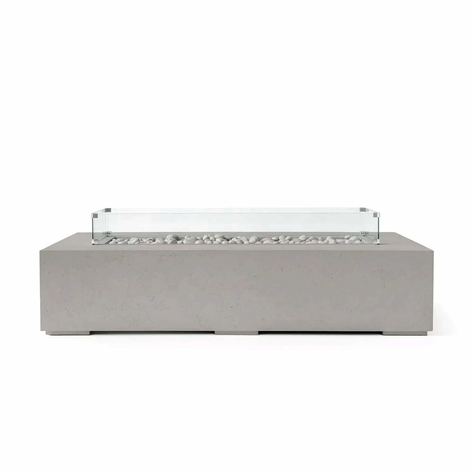 HPC Fire Hearth Products Controls Dekko GFRC Concrete Sonoma 72 x 33 Fire Pit in Sandstone finish with decorative ivory fire stones and a clear tempered glass wind guard. The warm-toned concrete exterior, clean rectangular shape, and modern fire media presentation create an inviting outdoor fire feature perfect for patios, outdoor seating areas, and contemporary landscape settings.
