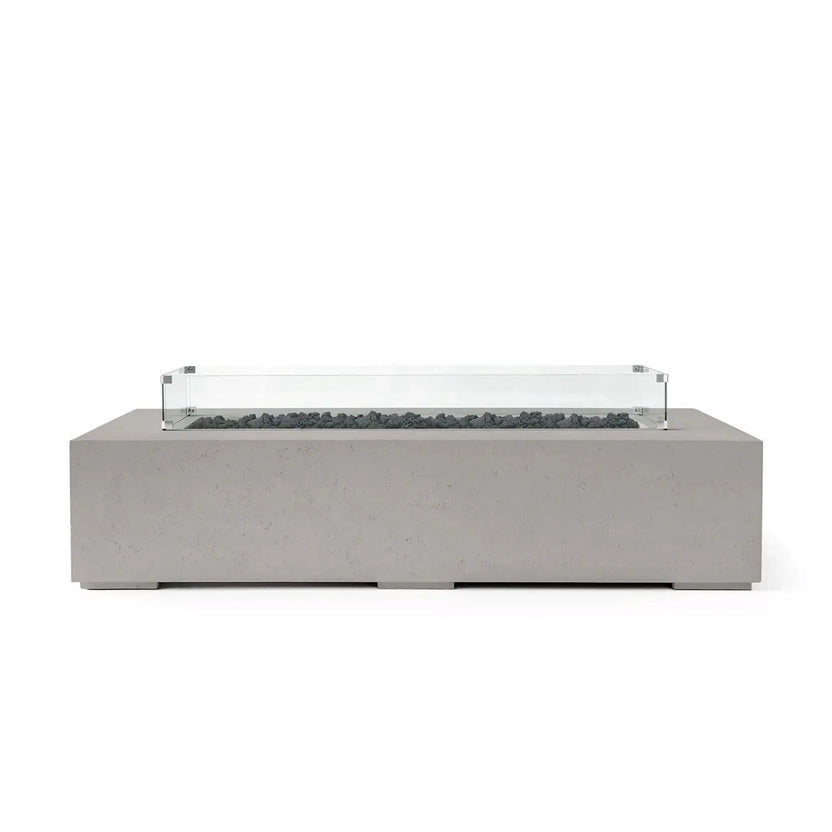 HPC Fire Hearth Products Controls Dekko GFRC Concrete Sonoma 72 x 33 Fire Pit in Sandstone finish featuring black lava rock media and a tempered glass wind guard. The modern rectangular fire table combines textured GFRC concrete construction with contrasting dark fire media, delivering a stylish outdoor focal point for upscale patios, decks, and entertainment spaces.