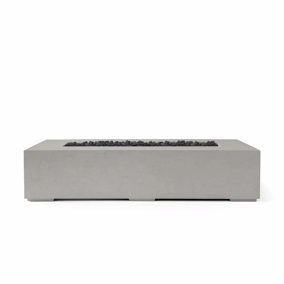 Studio product photograph of the HPC Fire & Hearth Products Dekko Sonoma 72 x 33 GFRC Concrete Fire Pit finished in Sandstone and paired with Lava Rock fire media. The elongated rectangular fire pit showcases clean lines, a modern low-profile silhouette, and a recessed burner channel filled with rugged black lava rock. Set against a white background, this image emphasizes the contrast between the warm sandstone concrete finish and the dark volcanic fire media for contemporary outdoor living environments.