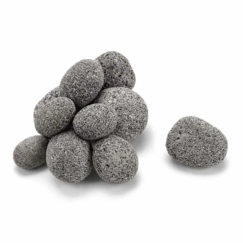 Close-up product image of smooth, rounded gray lava stones stacked in a small pile on a clean white background. The stones feature a speckled texture and uniform shape, ideal for gas fire pits and fire features, with one stone placed separately to highlight size and detail.