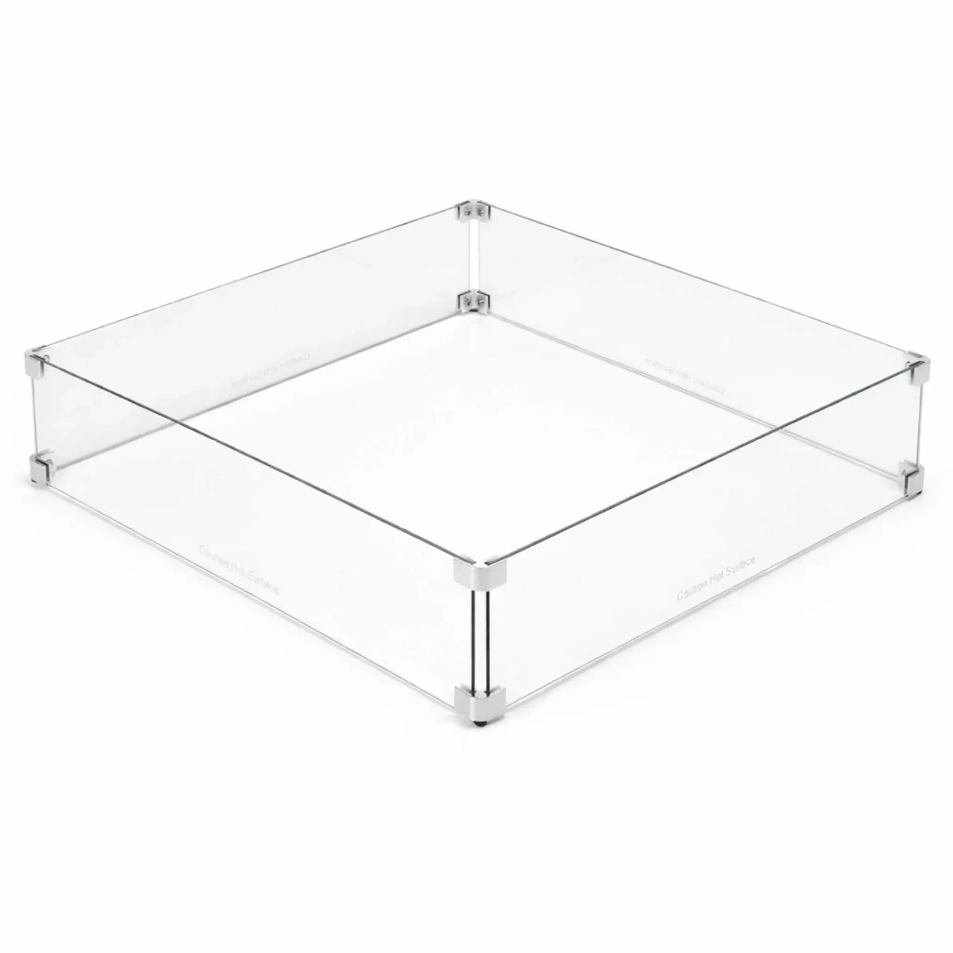 Square tempered glass fire pit wind guard displayed on a clean white background, featuring clear panels joined with polished metal corner brackets and raised support feet. This minimalist design highlights the protective barrier that shields flames from wind while maintaining a sleek, modern look for outdoor gas fire pit installations.